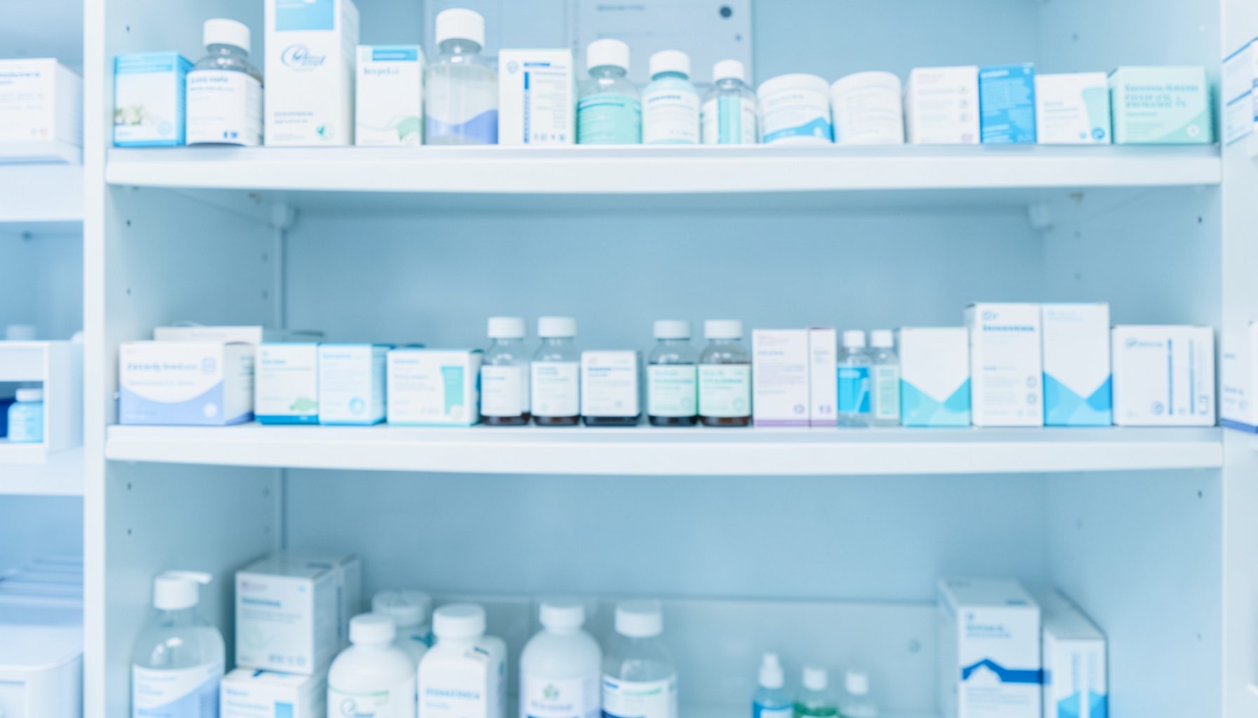 A clean pharmacy shelf with soft blue and white tones, conveying a calm and professional healthcare atmosphere.